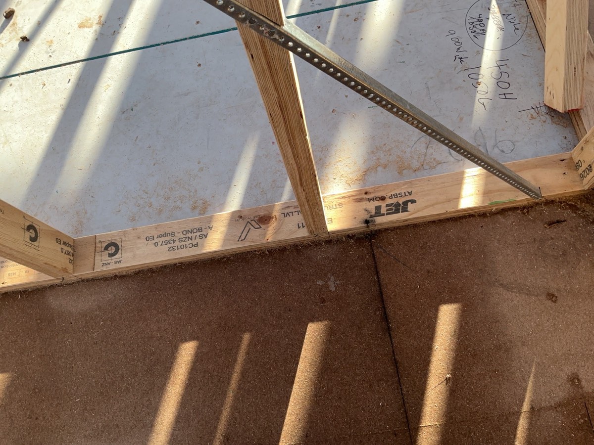 Tie down bolt missing, recorded during a frame inspection in Oran Park